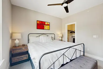 a bedroom with a bed and a ceiling fan at Serene Escape in Fraser in Fraser