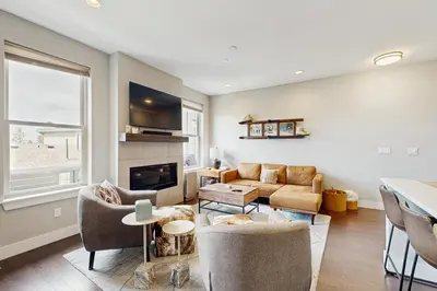a living room with a couch and a fireplace at Serene Escape in Fraser in Fraser