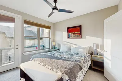 a bedroom with a bed and a ceiling fan at Serene Escape in Fraser in Fraser