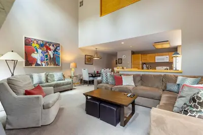 a living room with a couch and a table at 13 Liftside townhouse in Keystone