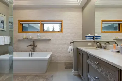 a bathroom with a tub and a sink at 13 Liftside townhouse in Keystone