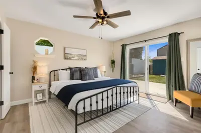 a bedroom with a bed and a ceiling fan at Downtown Windsor Home with Hot Tub and Pool Table in Windsor