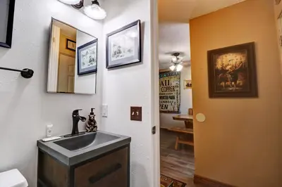 a bathroom with a sink and a mirror at Orofino Dillon 104 condo in Dillon