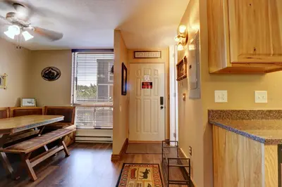 a kitchen with a table and a dining room at Orofino Dillon 104 condo in Dillon