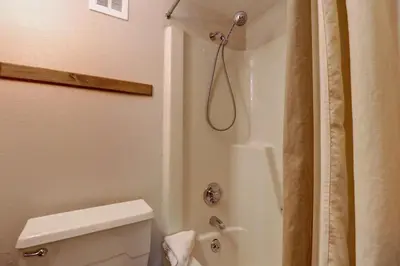 a bathroom with a shower and a toilet at Orofino Dillon 104 condo in Dillon