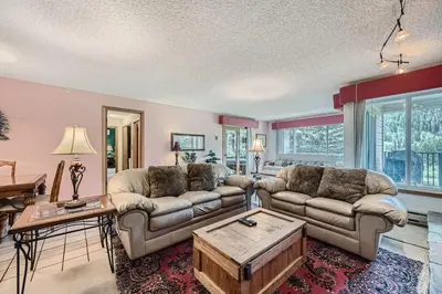 a living room with two couches and a coffee table at 122 Cinnamon Ridge condo in Keystone