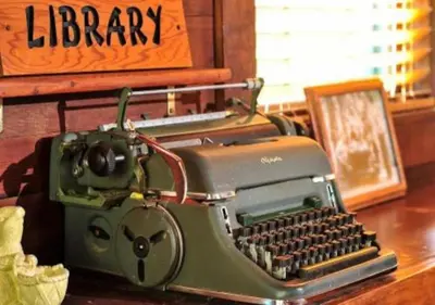 a green typewriter sitting on top of a desk at Diamond - The Historic Crags Lodge - ST in Estes Park