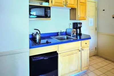 a small kitchen with a sink and a microwave at Diamond - The Historic Crags Lodge - ST in Estes Park