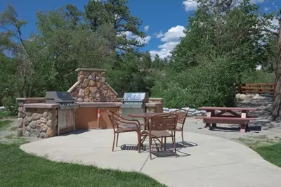 a patio with a grill and a table and chairs at Worldmark - Estes Park 2BD in Estes Park