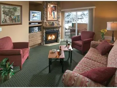 a living room with a couch and a fireplace at Worldmark - Estes Park 2BD in Estes Park