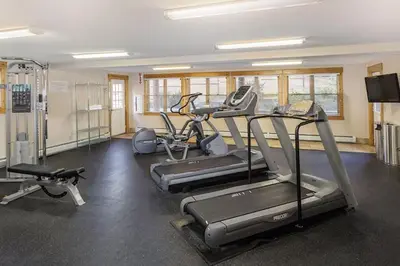 a gym with treadmills and ellipticals in a room at Worldmark - Estes Park 2BD in Estes Park