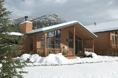 a house with snow on the ground in front of it at Worldmark - Estes Park 2BD in Estes Park