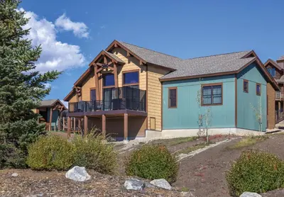 a house with a blue and brown at Worldmark Granby Rocky Mountain 1BD in Granby