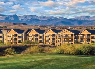 a view of a resort with mountains in the background at Worldmark Granby Rocky Mountain 1BD in Granby