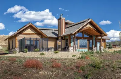 a large house with a gambrel roof at Worldmark Granby Rocky Mountain 1BD in Granby