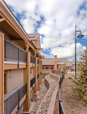 a building with balconies and a street light at Worldmark Granby Rocky Mountain 2BD in Granby