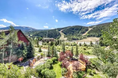 an aerial view of a mountain with a red barn at Tenderfoot Lodge 1 Bedroom At The Mountain House Base in Keystone