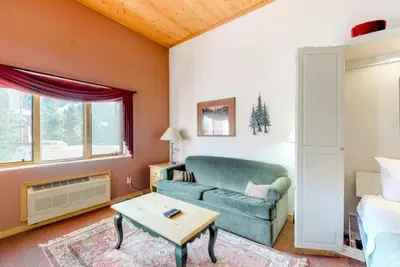 a living room with a couch and a table at Studio Condo At Gateway Lodge In Keystone in Keystone