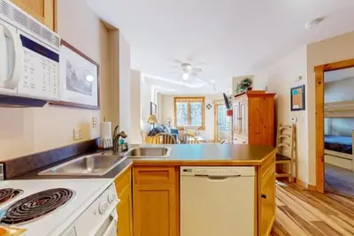 a kitchen with a sink and a stove at Dakota Lodge 2 Bedroom Condo In River Run Village in Keystone