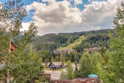 an aerial view of a mountain with a house and trees at Dakota Lodge 2 Bedroom Condo In River Run Village in Keystone