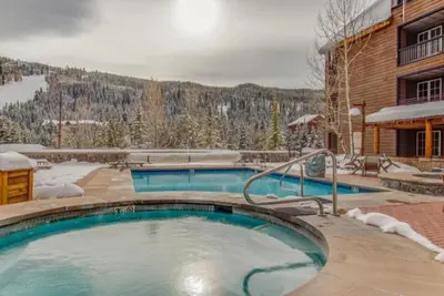 a large swimming pool in front of a building at Dakota Lodge 2 Bedroom Condo In River Run Village in Keystone