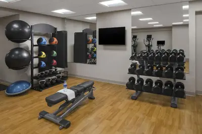 a gym with a bunch of weights and equipment at Hyatt Place Denver Cherry Creek in Denver