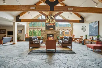 a living room with couches and a fireplace at Cozy Ski-In Ski-Out Condo with Heated Pool in Keystone
