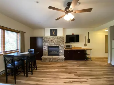 a living room with a table and a fireplace at Gateway Lodge 5037 by SummitCove Lodging in Keystone