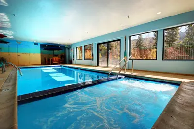 a large swimming pool in a house at Gateway Lodge 5037 by SummitCove Lodging in Keystone