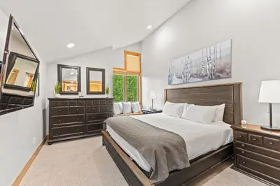 a bedroom with a large bed and a television at Ski Tip 8709 : 2 in Keystone