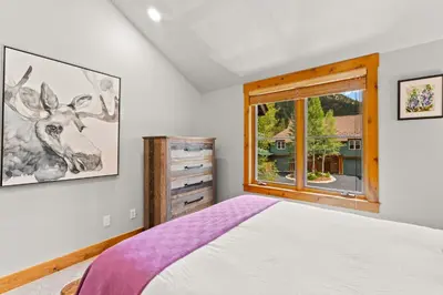 a bedroom with a bed and a window at Ski Tip 8709 : 2 in Keystone