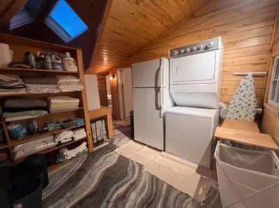 a small kitchen with a refrigerator in a tiny house at 3 Bedroom - Awesome Views, Light, Deck in Idaho Springs
