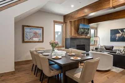 a dining room with a table and chairs at Aprez Retreat condo in Winter Park
