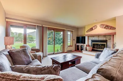 a living room with couches and a fireplace at Steps to Shadow Mountain Lake Grand Lake Condo in Grand Lake