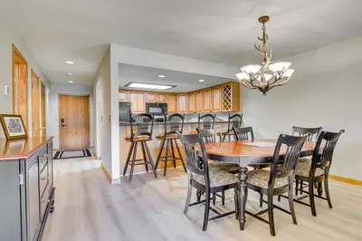 a kitchen and dining room with a table and chairs at Steps to Shadow Mountain Lake Grand Lake Condo in Grand Lake