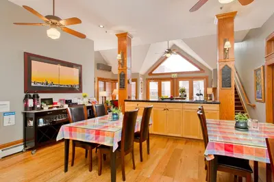 a kitchen and dining room with a table and chairs at The Bradley Boulder Inn in Boulder