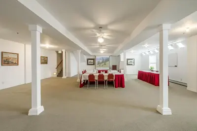 a large room with a table and chairs in it at The Bradley Boulder Inn in Boulder