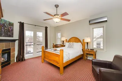 a bedroom with a bed and a fireplace at The Bradley Boulder Inn in Boulder