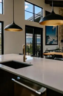 a kitchen with a sink and some windows at Cloud N9NE Chalet in Fraser