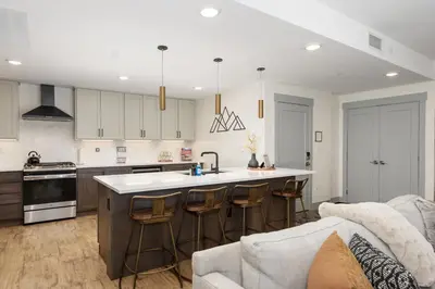 a kitchen with a couch and a kitchen island with a sink at Timber Fox 1208 apts in Winter Park
