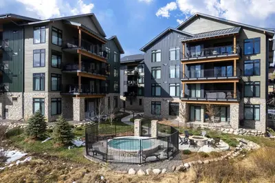 an image of an apartment complex with a pool at Timber Fox 1208 apts in Winter Park