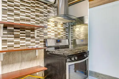 a kitchen with an oven and a stove at Aurora Abode 7 Mi to Dtwn Denver! in Aurora