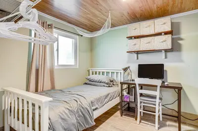 a bedroom with a bed and a desk with a computer at Aurora Abode 7 Mi to Dtwn Denver! in Aurora
