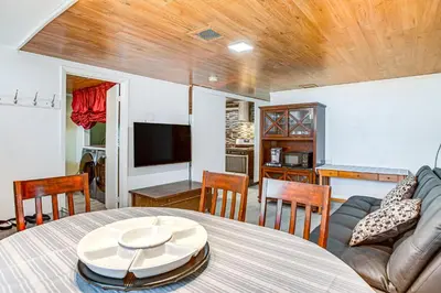 a living room with a table and a couch at Aurora Abode 7 Mi to Dtwn Denver! in Aurora