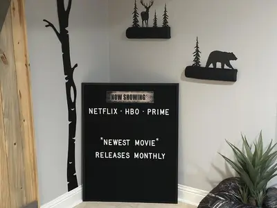 a sign with a bear and trees on a wall at Immersive Spa Retreat with Sauna & 15m to Red Rocks in Lakewood