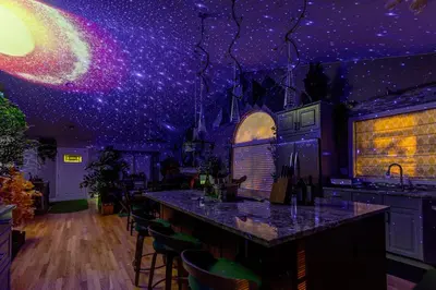 a bar in a kitchen with a starry ceiling at Immersive Spa Retreat with Sauna & 15m to Red Rocks in Lakewood
