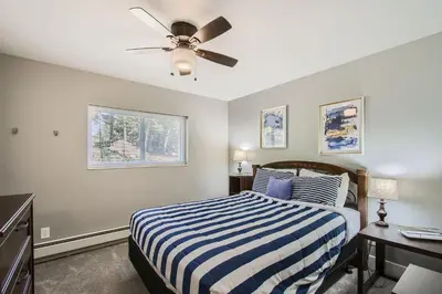 a bedroom with a bed and a ceiling fan at Golden Gate Getaway home in Black Hawk