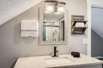 a bathroom with a sink and a mirror at Golden Gate Getaway home in Black Hawk