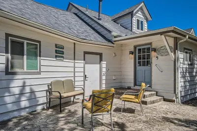 a house with two chairs and a table on a patio at Golden Gate Getaway home in Black Hawk