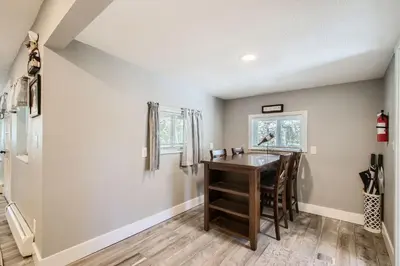 a kitchen with a table and a sink in a room at Golden Gate Getaway home in Black Hawk